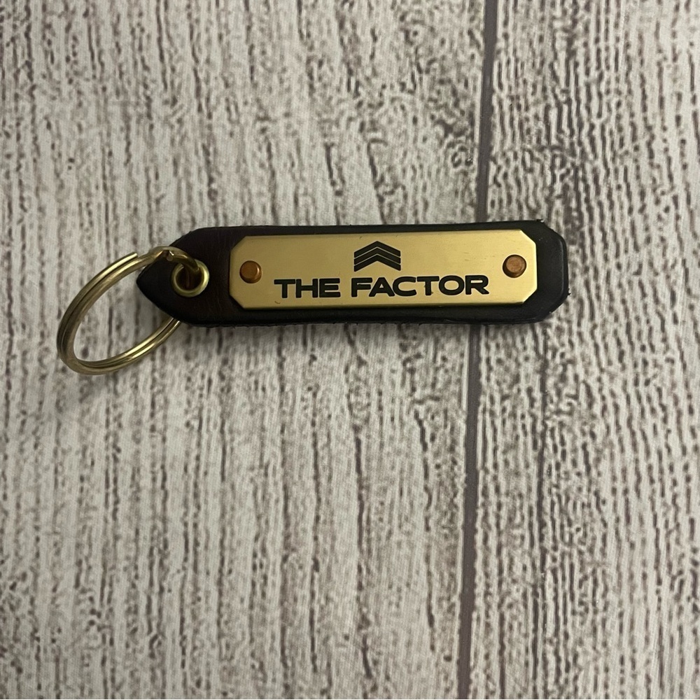 The Factor Gold and Black Keychain